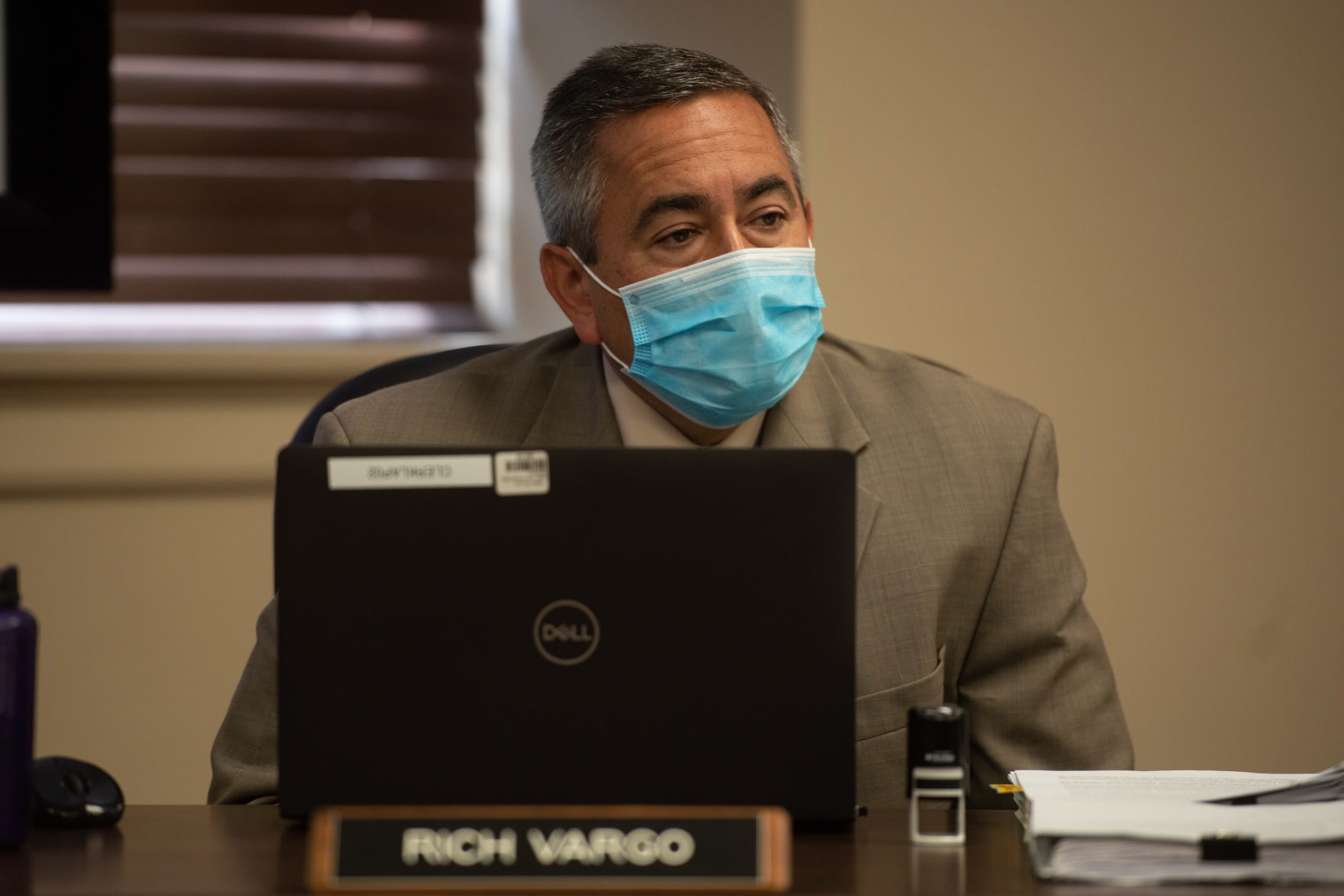 County Clerk Rich Vargo sits at his desk in the Riley County Commission Meeting on Thursday morning.